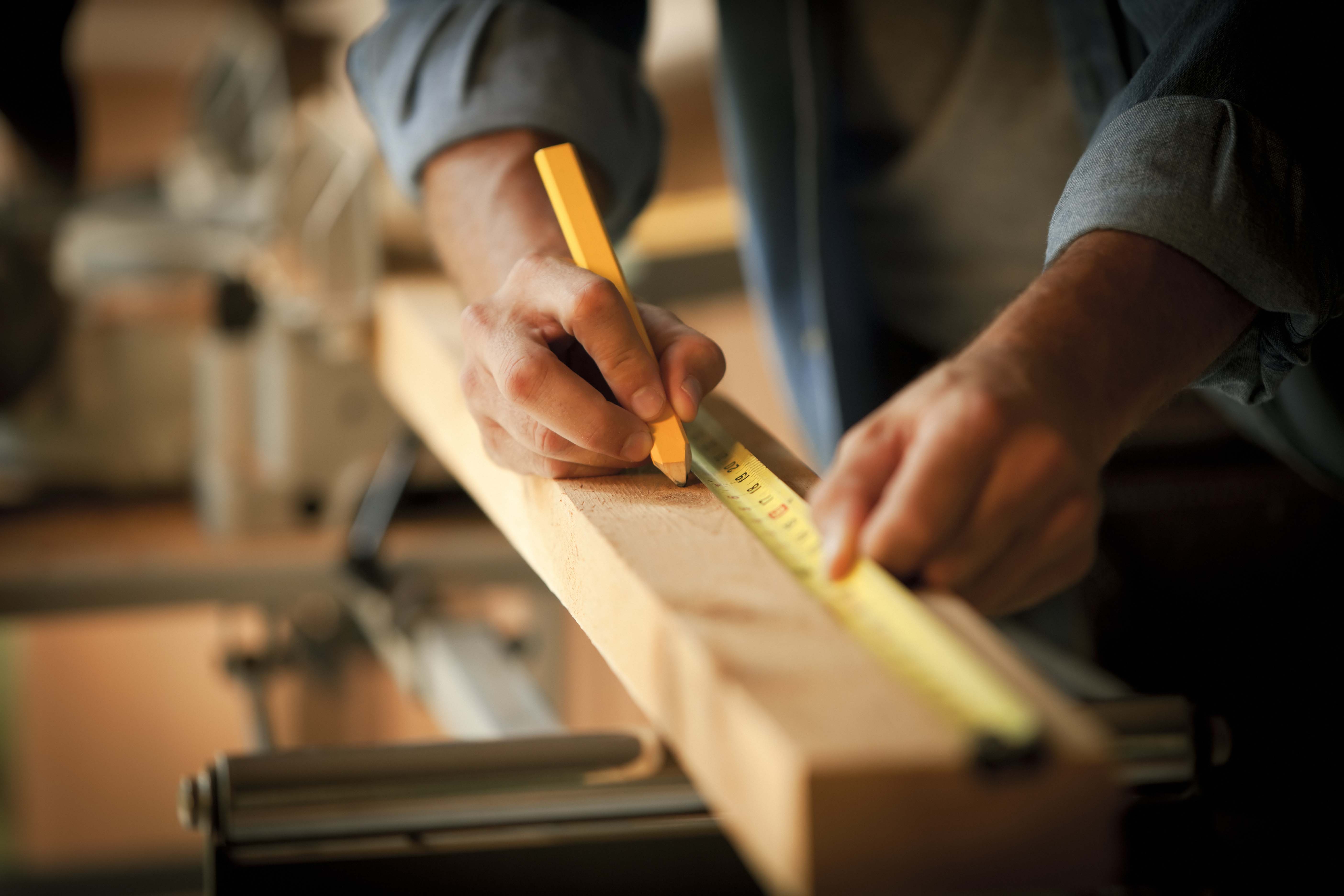 Carpenter measuring wood